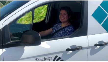Trainer in the driver seat of the mobile truck.